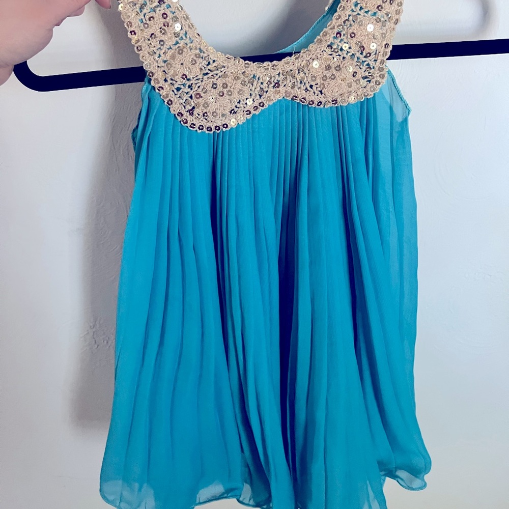 Girls (4/5) pleated Party Dress NWOT. New without tags has never been worm.